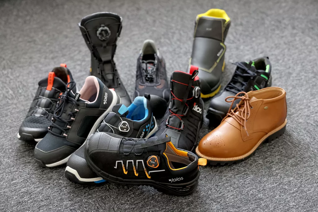Range of JALAS safety shoes and safety boots for different work environments, displayed together.
