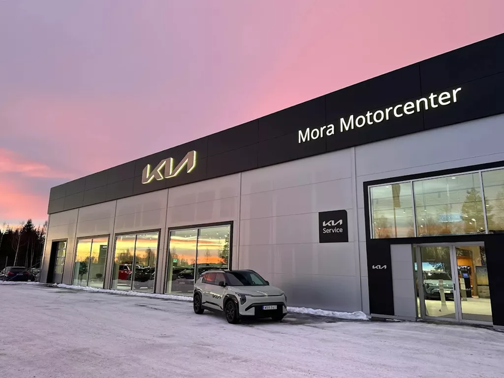 Mora Motorcenter Kia dealership exterior in winter.
